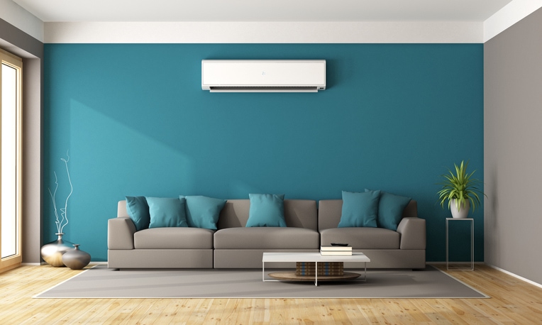 This is a modern living room with sofa and air conditioner as a 3d rendering