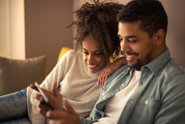 Young couple researching the value of geothermal heat pumps.