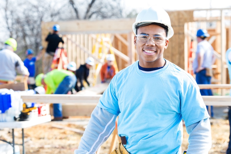 Schedule Your Annual Furnace Inspection Now. Confident volunteer construction foreman at work site.