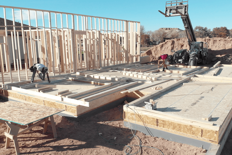 Video - HVAC Equipment for Your New Home. New home foundation being built outside on a clear day.