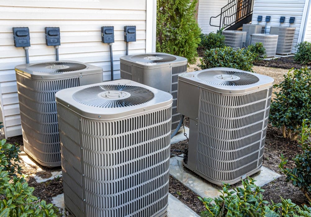 Four air conditioning units outside residential area in Waco